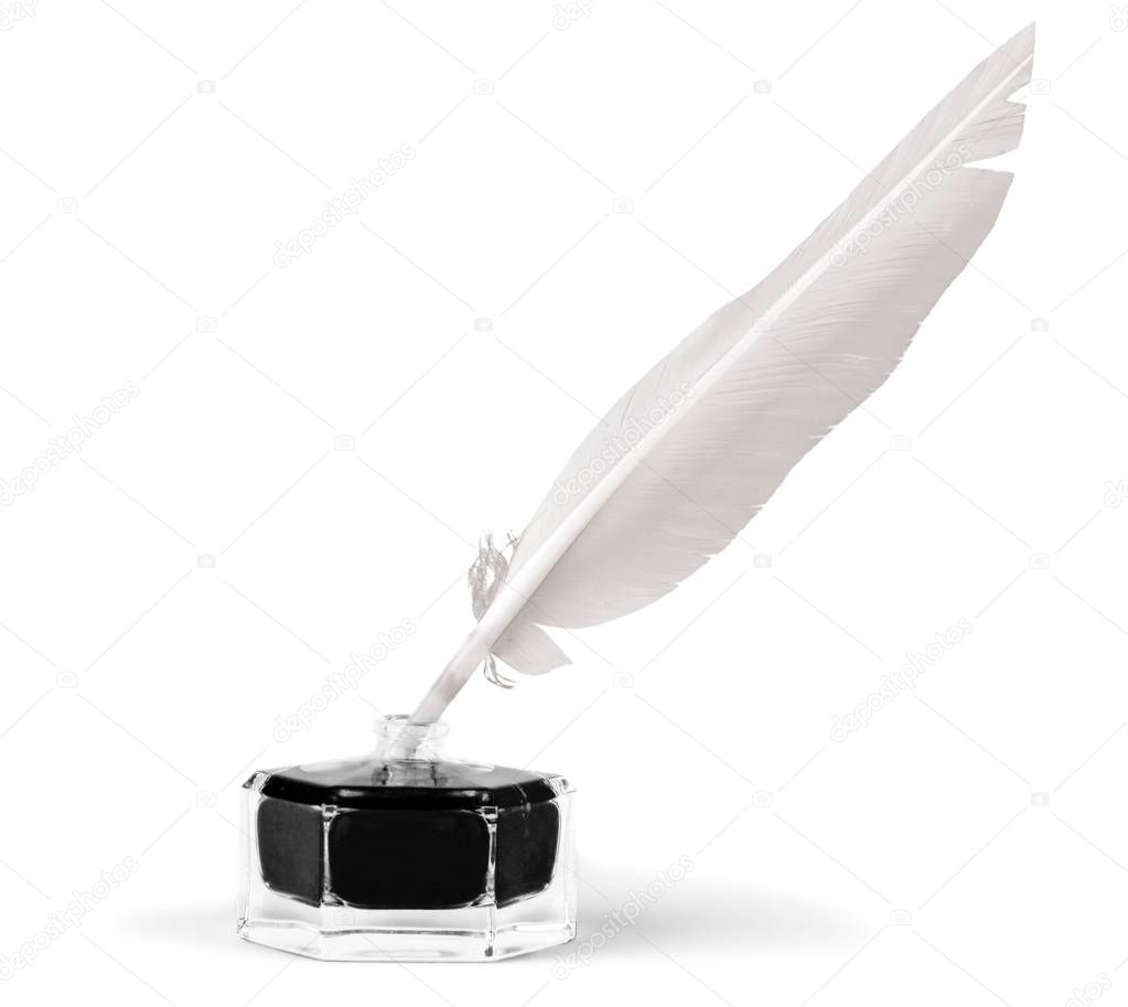 Feather quill pen and glass inkwell 
