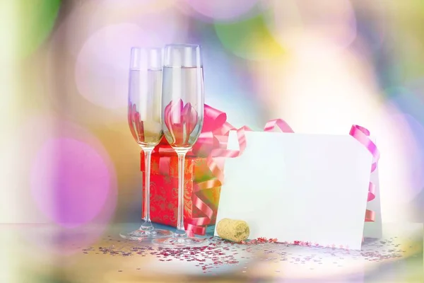 Flute glasses of champagne on bright background