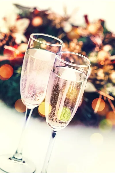 Flute glasses of champagne on festive background