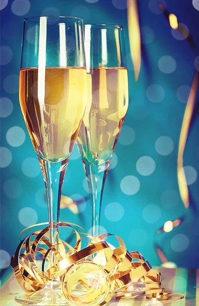 Flute glasses of champagne on festive background