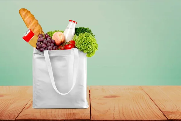 Reusable shopping bag full of groceries