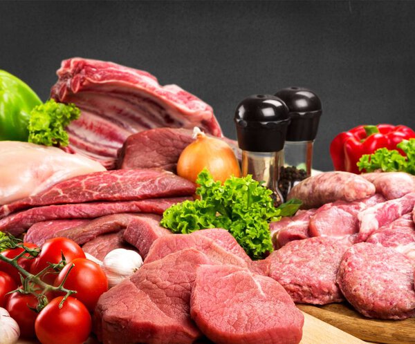 Raw Meat slices on table background 
