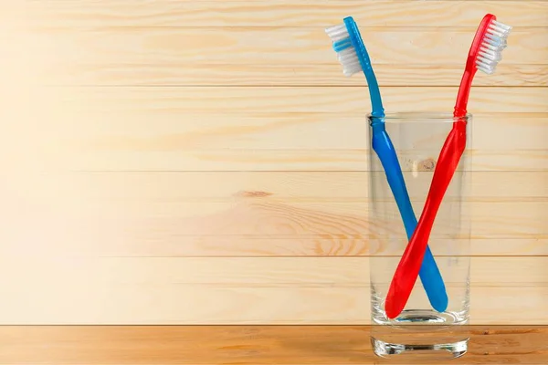 Colorful Toothbrushes in  lass — Stock Photo, Image