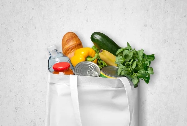 Reusable shopping bag full of groceries