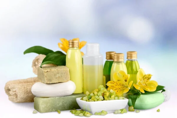 spa treatment concept. White towel, bottles with cosmetics, towel and soap