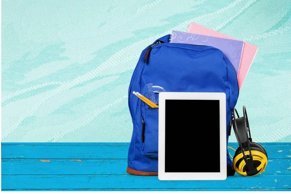 School Backpack with stationery, back to school background