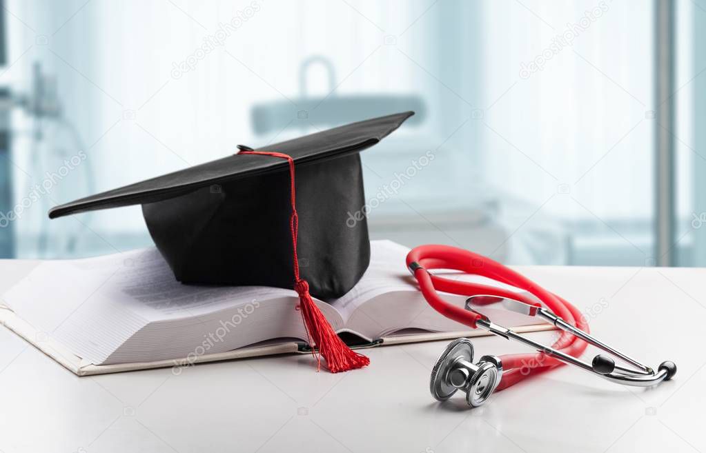 Stethoscope and graduate hat.
