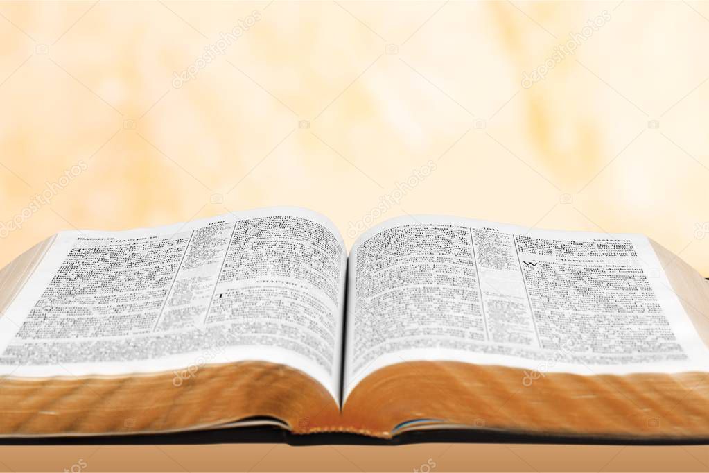 Opened Holy bible book on table 