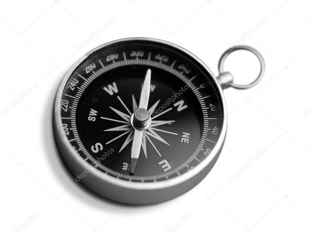 metal antique compass on white background