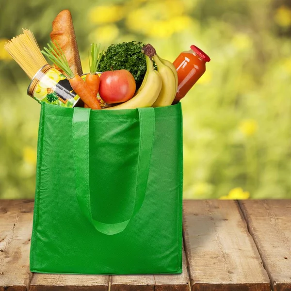 Reusable shopping bag full of groceries