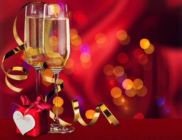 Flute glasses of champagne on bright background