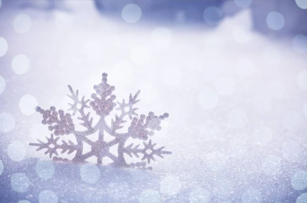 Christmas snowflake on fake snow Stock Photo by ©billiondigital