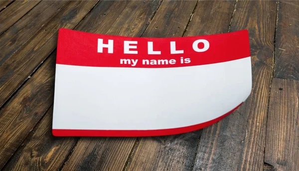 Hello My Name Is Tag on wooden background