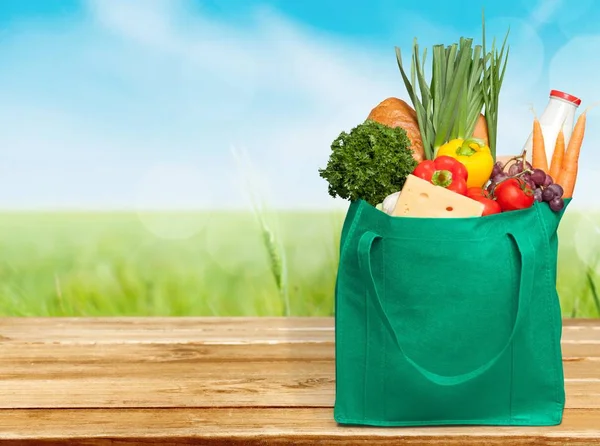 Reusable shopping bag full of groceries