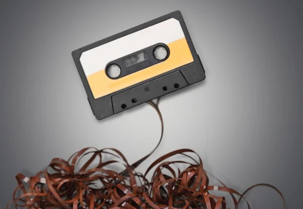 Old tape cassette on light background