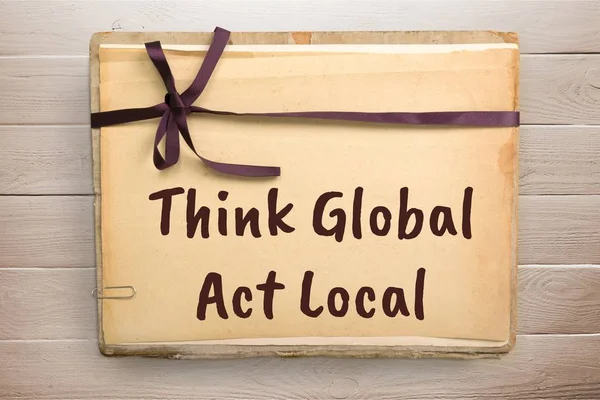 think global, act local text on vintage paper
