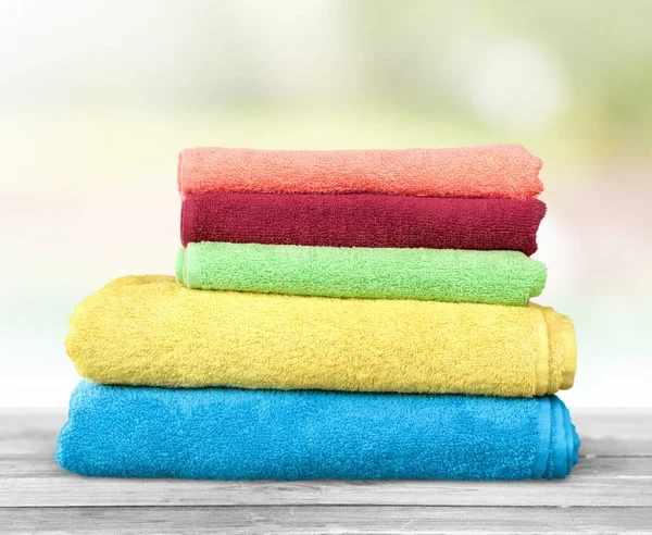 Pile of  fluffy bright towels, closeup