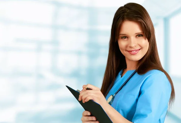 Young Female Doctor Clipboard Background — Stock Photo, Image