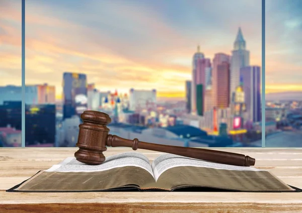 Wooden judge gavel with book, law and justice concept
