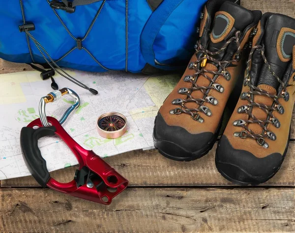 Hiking Accessories. Boots, Backpack, Sunglasses, Photo Camera, Map,  Smartphone, Flashlight And Others. Top View. Stock Photo, Picture and  Royalty Free Image. Image 66696911.