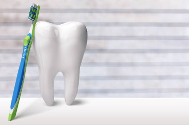 büyük diş modeli ve diş fırçası