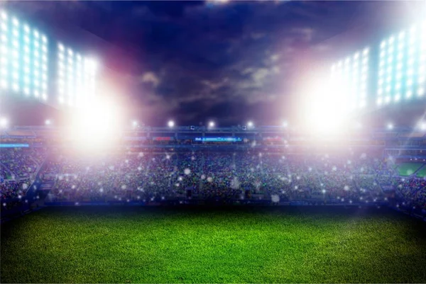 Illuminated football stadium at night