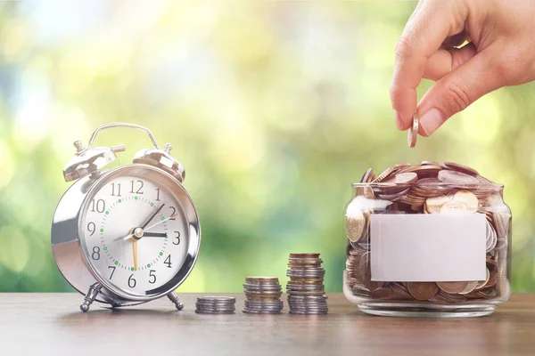 Hand Putting Coins Jar Alarm Clock Table Time — Stock Photo, Image