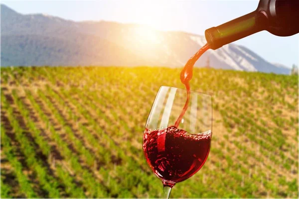 Red Wine Being Poured Wineglass Closeup — Stock Photo, Image