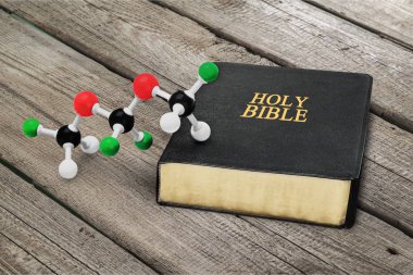 holy bible book and molecule model clipart