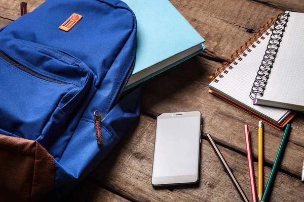 School Backpack with stationery, back to school background