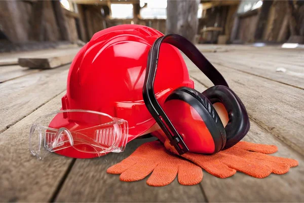 Red hard hat and tools, construction concept