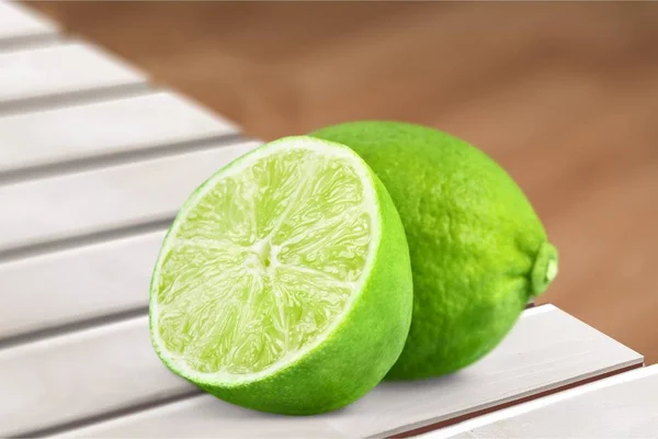 Whole Sliced Limes Wooden Table Citrus Fruit — Stock Photo, Image