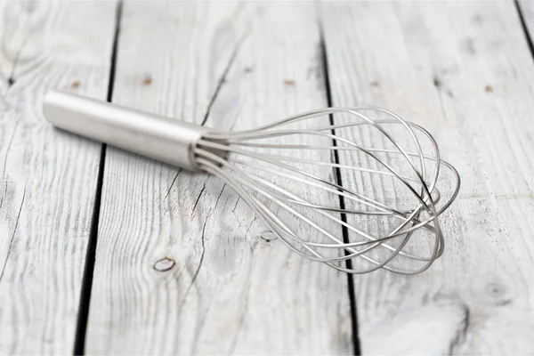 Stainless Steel Whisk Wooden Table — Stock Photo, Image