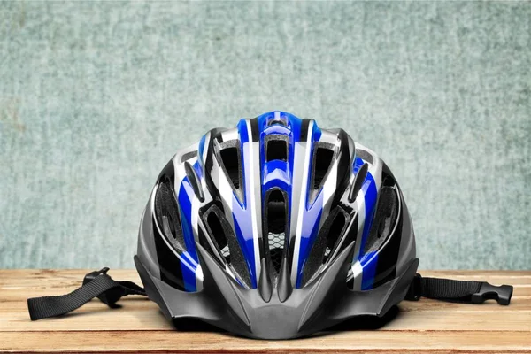 One cycling helmet on wooden background