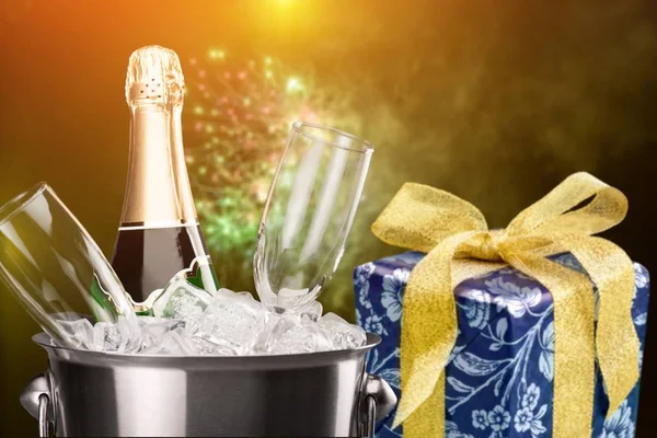 glasses of champagne and bottle in ice bucket, celebration concept