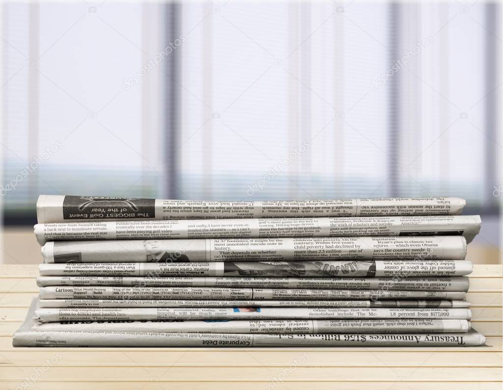 Pile of newspapers on background, close-up view