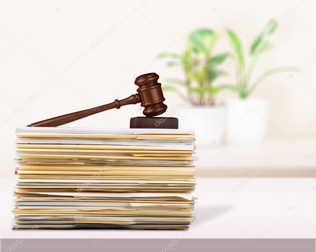 stack of legislation documents and wooden gavel, legal system and justice 