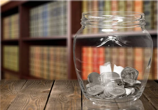 Money Jar with coins, saving money concept