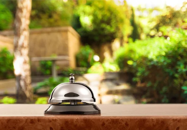 Reception service desk bell on blurred background