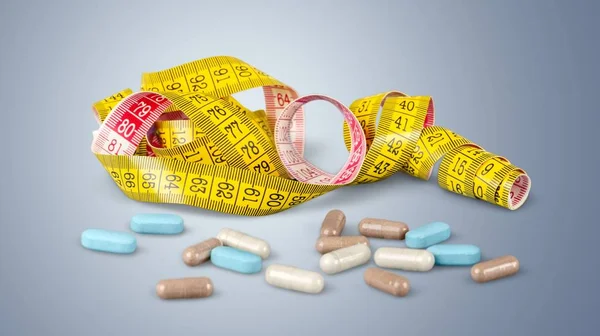 Supplement for weight loss, medical pills and measuring tape