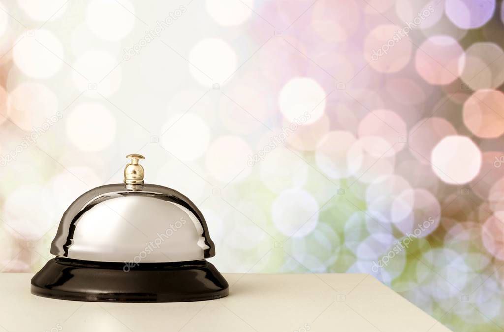 Reception service desk bell on blurred background 