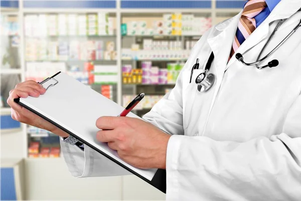 Doctor with medical clipboard