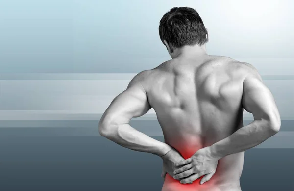 Man suffering from pain in back — Stock Photo, Image