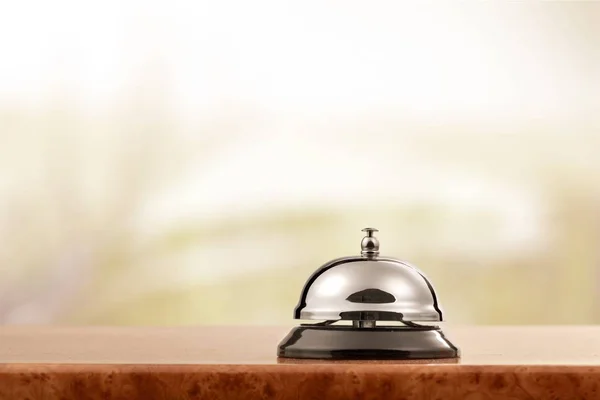 Reception service desk bell on blurred background