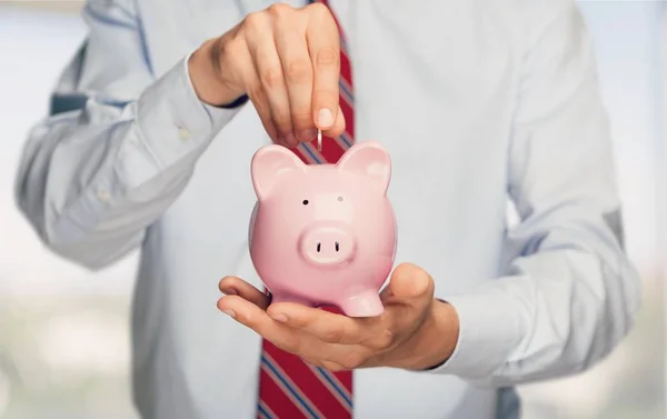 Empresario Holding Piggy Bank —  Fotos de Stock