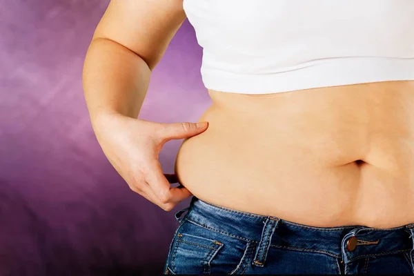 Woman with fat belly — Stock Photo, Image