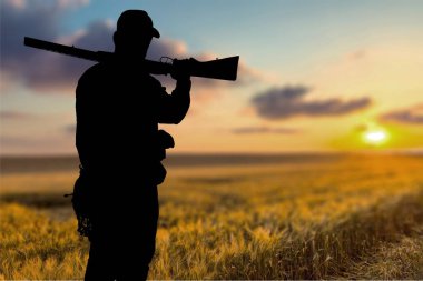 bir silah ile bir adamın silueti, avı kavramı