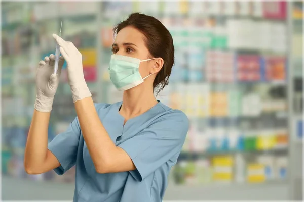 Young Female Doctor Holding Syringe — Stock Photo, Image