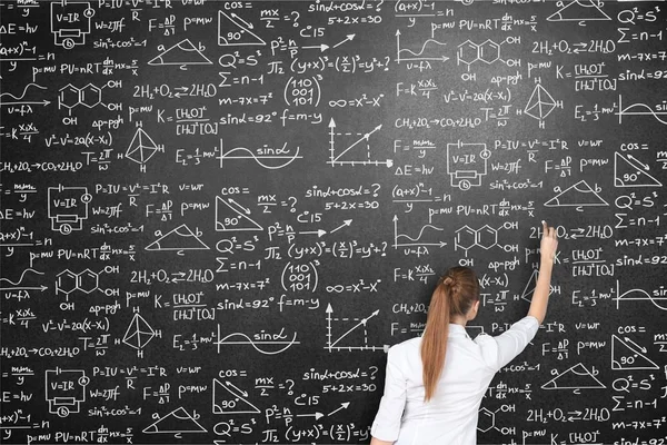 Young Woman Writing Formulas Blackboard Back School — Stock Photo, Image