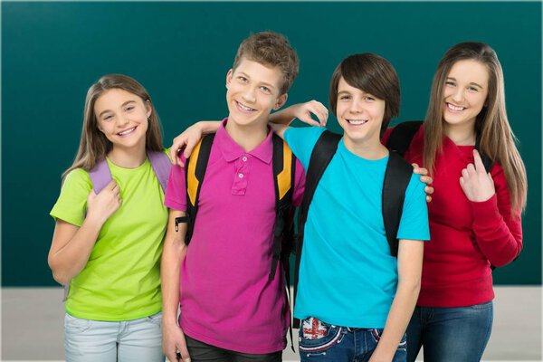 happy group of young people in school